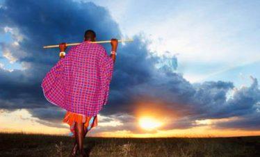 Maasai Elder watching the sunset over the Maasai Mara - Serengeti Plains