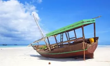 Zanzibar White Sandy Beach with a Dhow